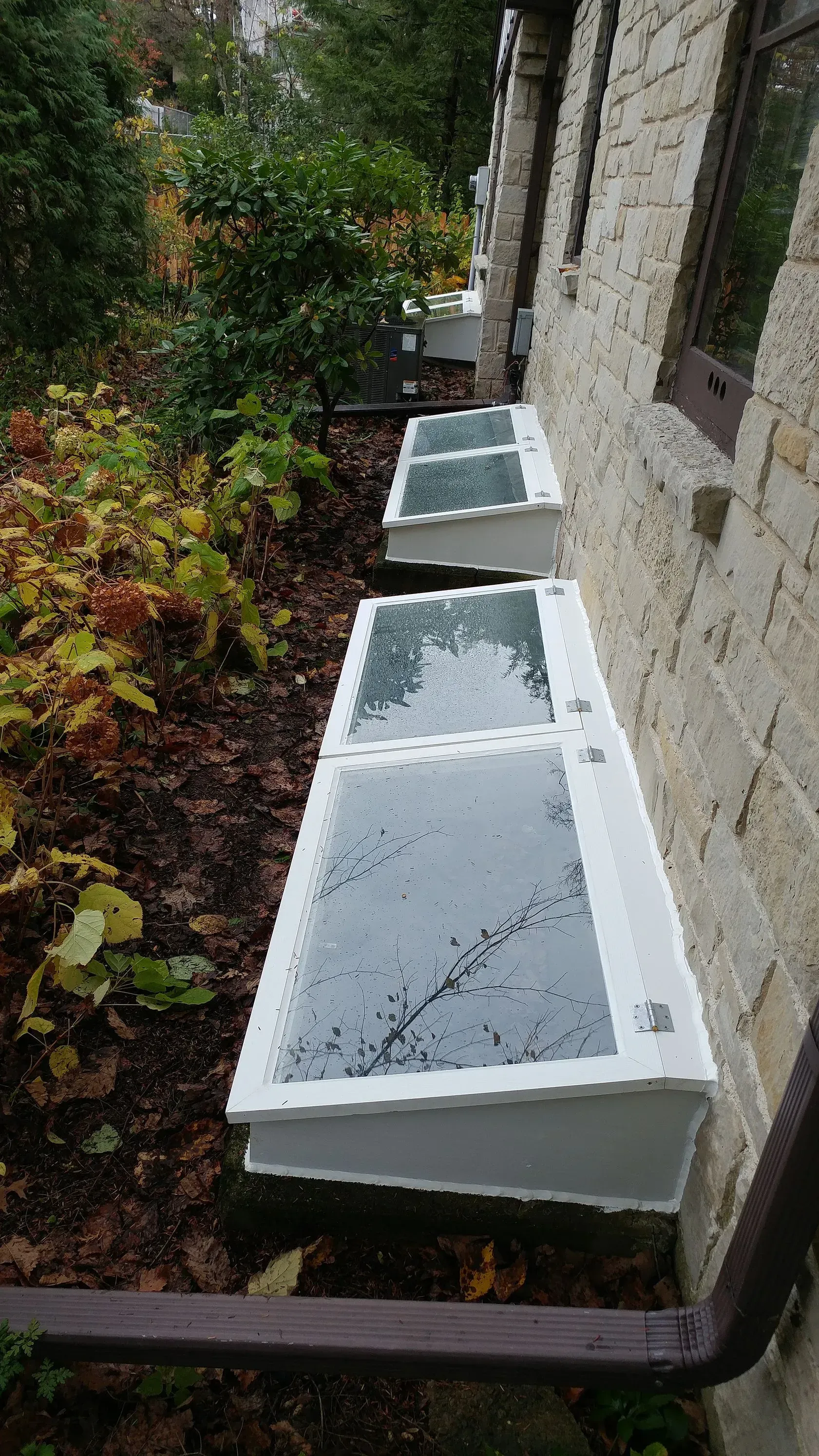 A row of window covers on the side of a building.