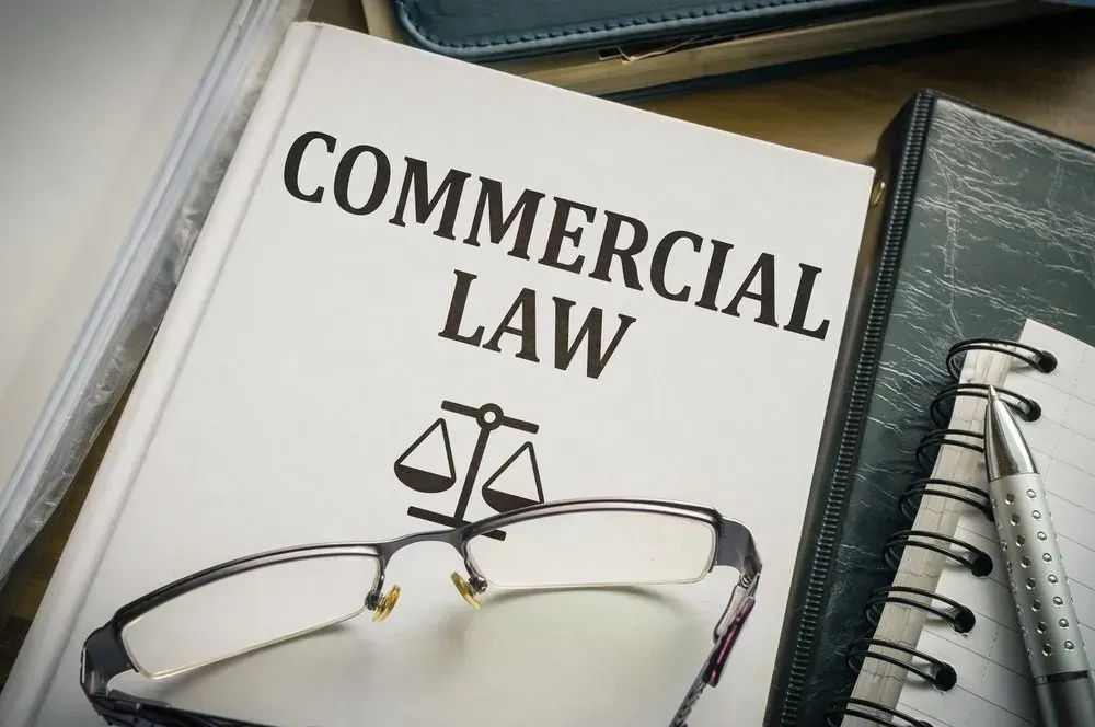 Commercial Law Book with Glasses — David Hunter Solicitor in Lismore, NSW