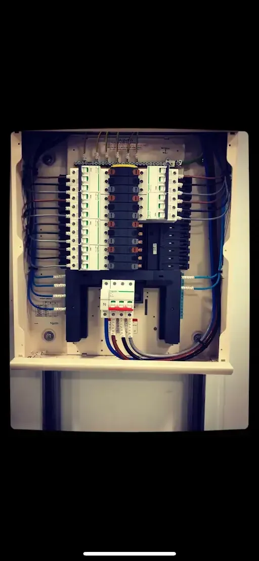 Electrical panel with breakers and wiring.