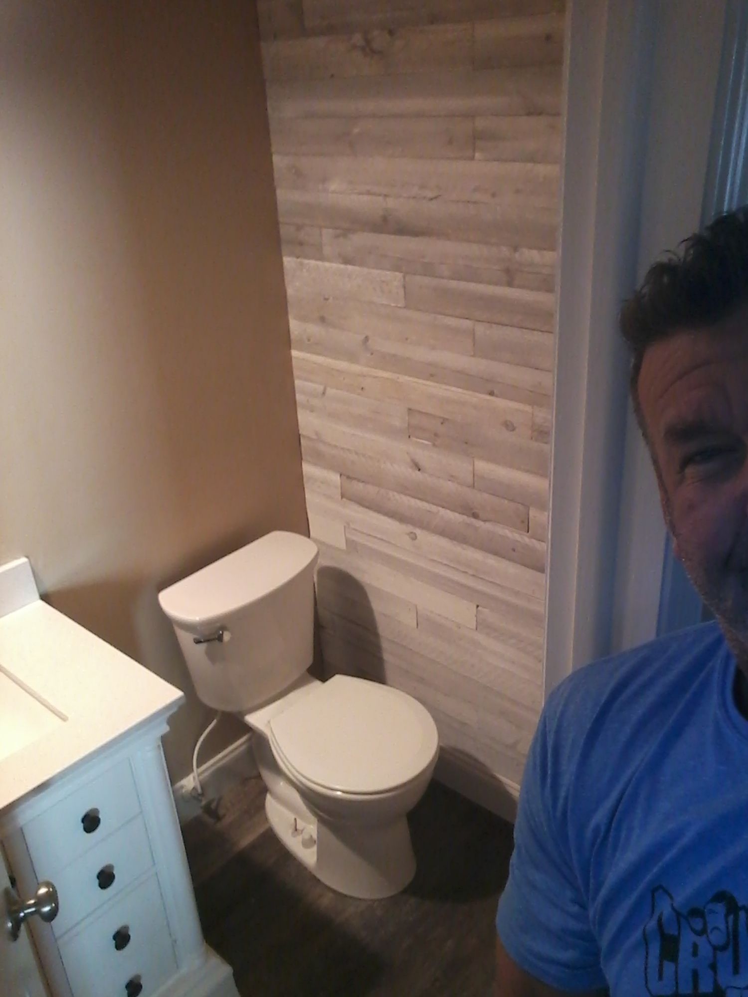 a selfie of the owner Patrick with they newly installed toilet