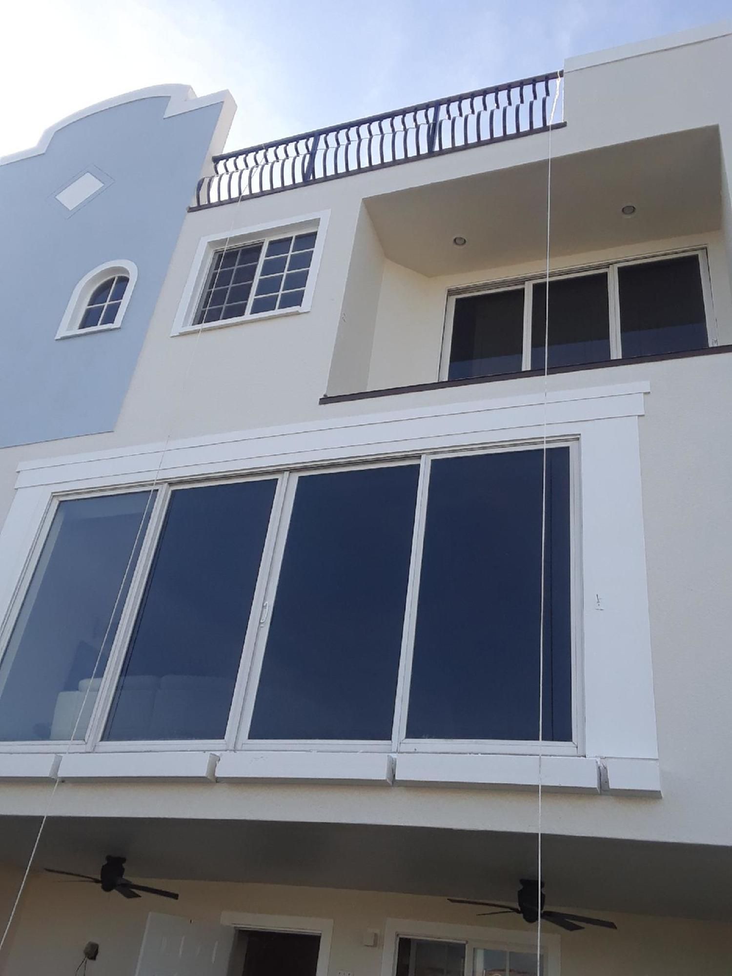 a building with a balcony and a lot of windows