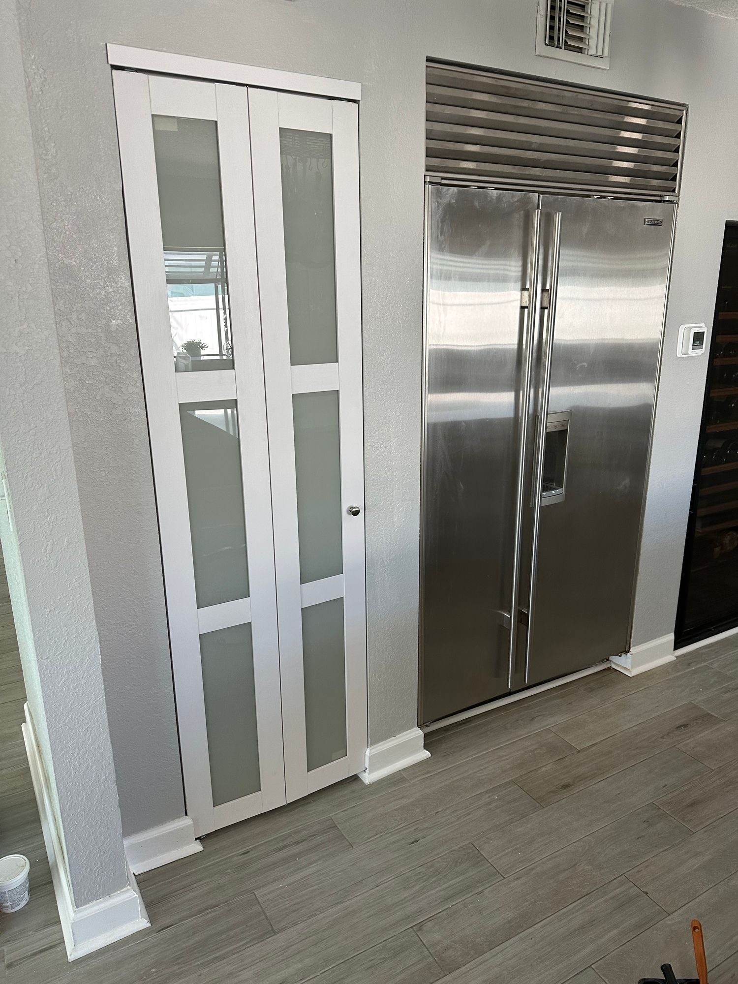 a kitchen with a stainless steel refrigerator and a stainless steel freezer .