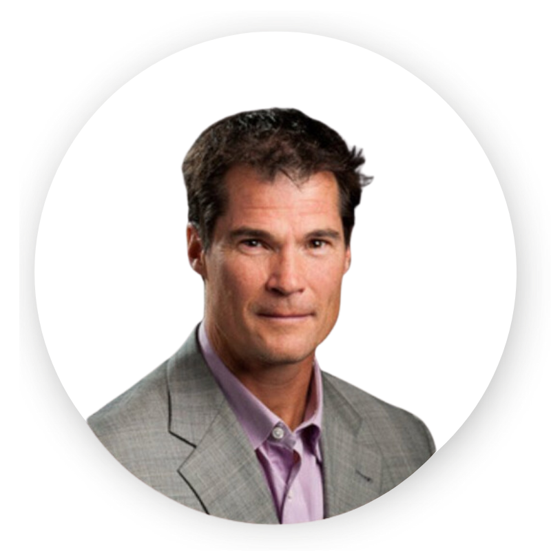 A man in a suit and pink shirt is in a circle on a white background