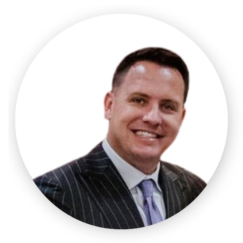 A man in a suit and tie is smiling in a circle.