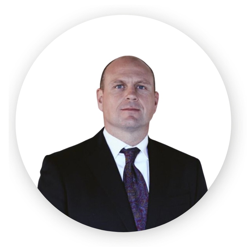 A man in a suit and tie is in a white circle