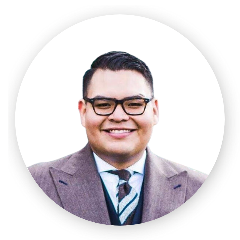 A man in a suit and tie is smiling in a circle.