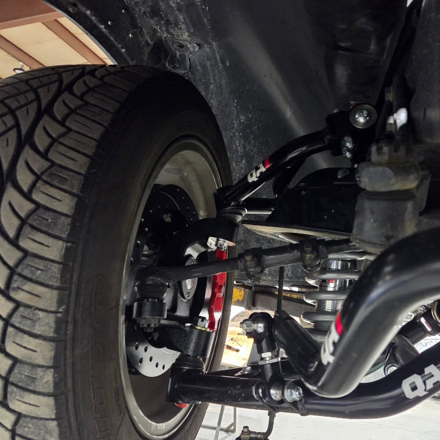 A close up of the underside of a car with the letters oa on it