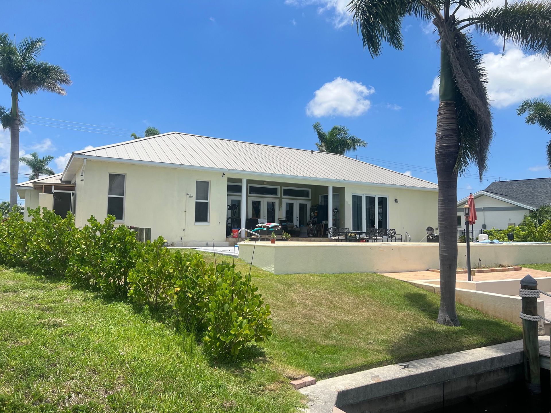 Back of Home Featuring Shingle Roofing