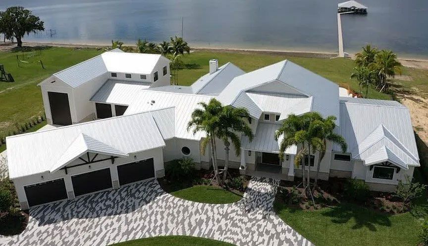 Large Home Featuring Metal Roofing Surface