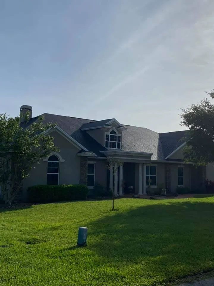 Local Home Featuring Pillars and Shingle Roofing Surface
