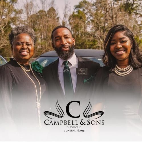 Three people posing outdoors in formal attire beside a black car, with a Campbell & Sons funeral home logo.