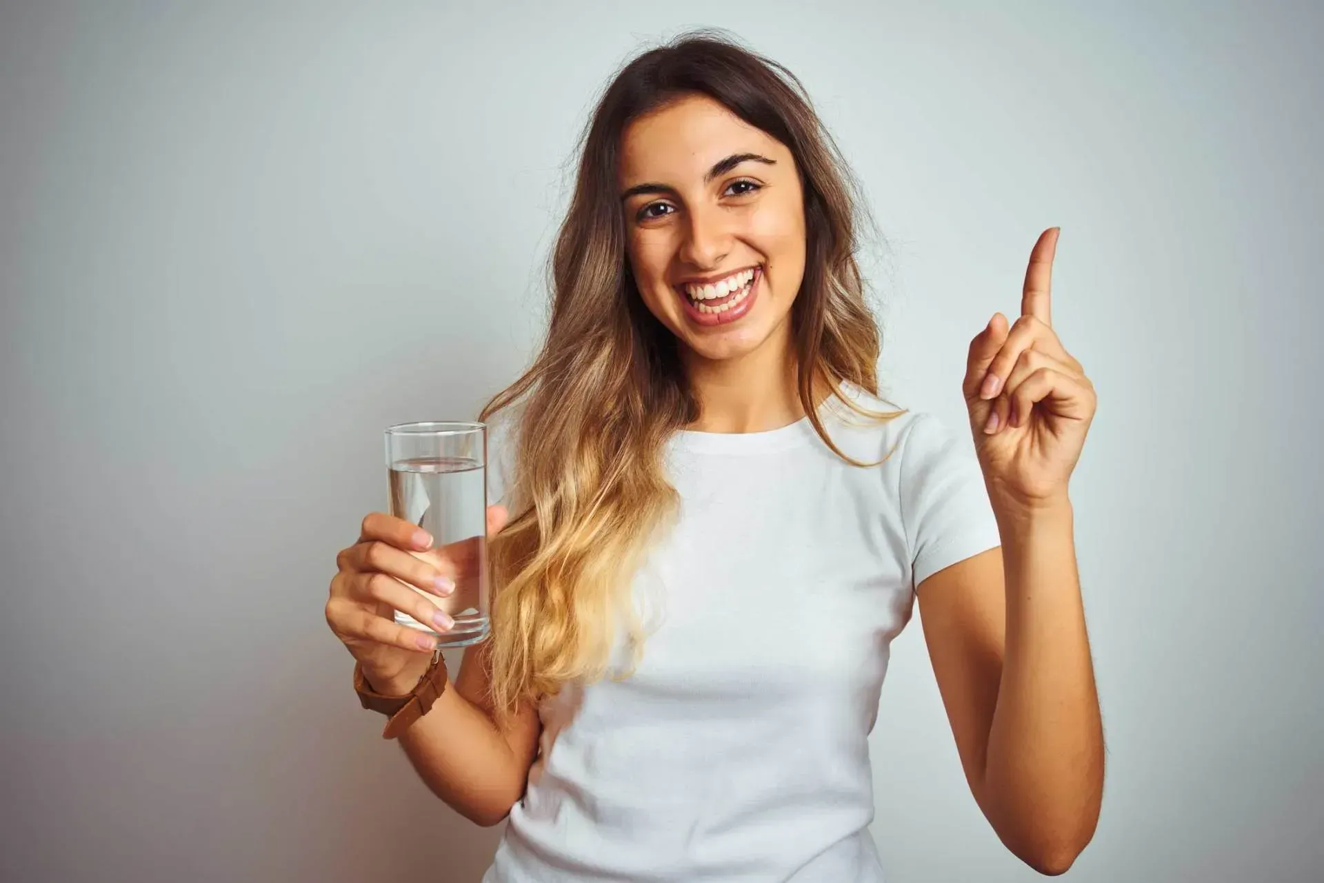 Louisiana mom enjoying, fresh, clean water in her home, using Brilliant Water Technologies