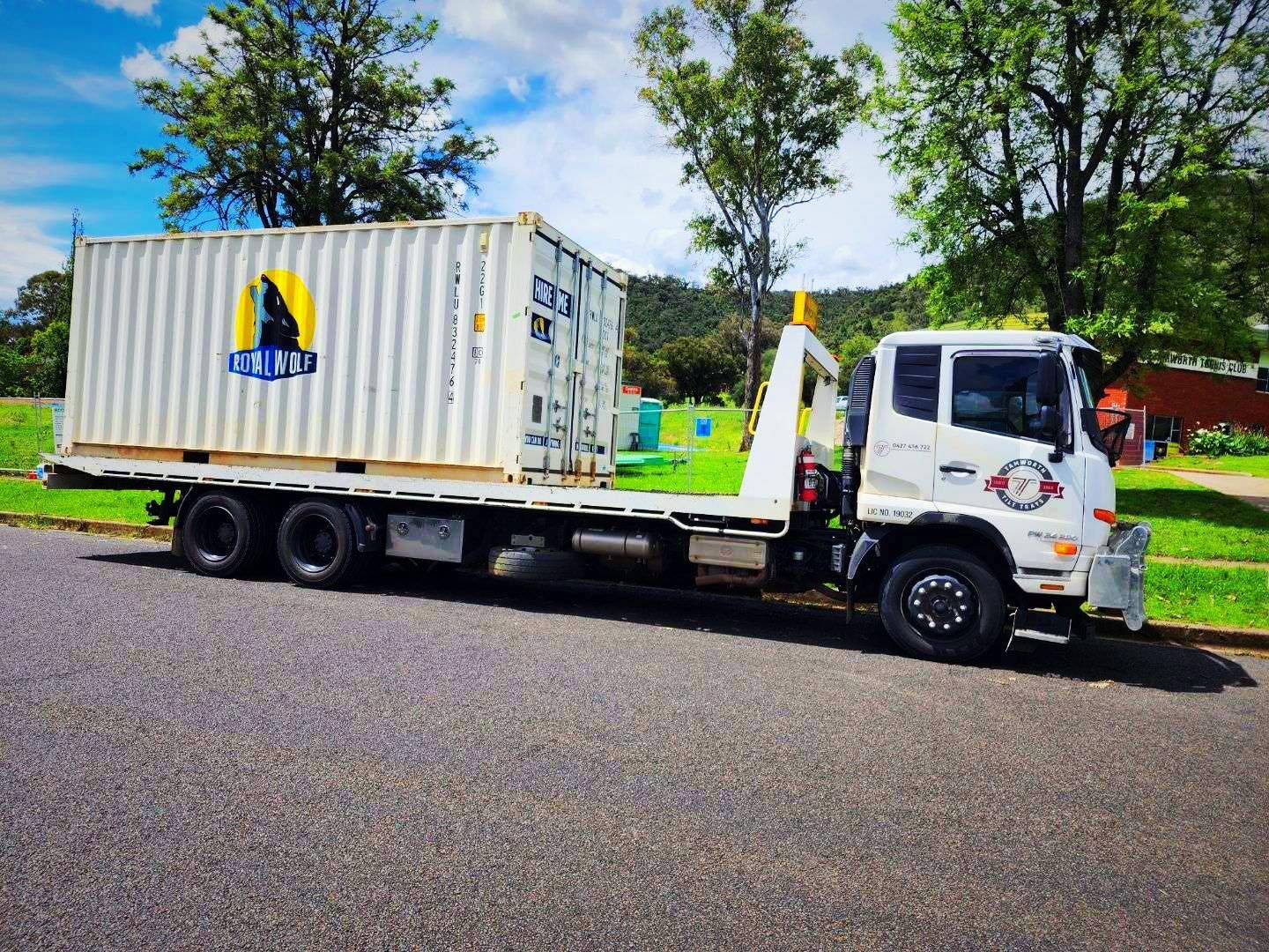 A White Flatbed Truck Parked on a Paved Road — Tamworth Tilt Trays in Tamworth, NSW