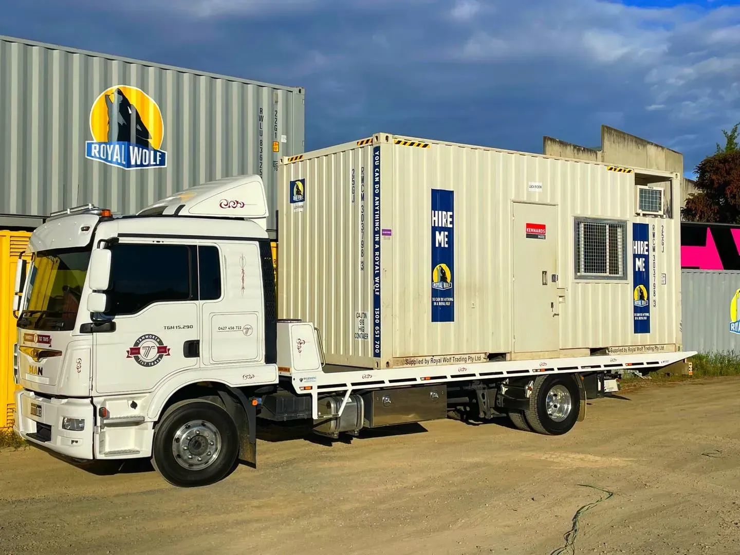 A White Flatbed Truck Carrying a Beige Portable Shipping Container — Tamworth Tilt Trays in Tamworth, NSW