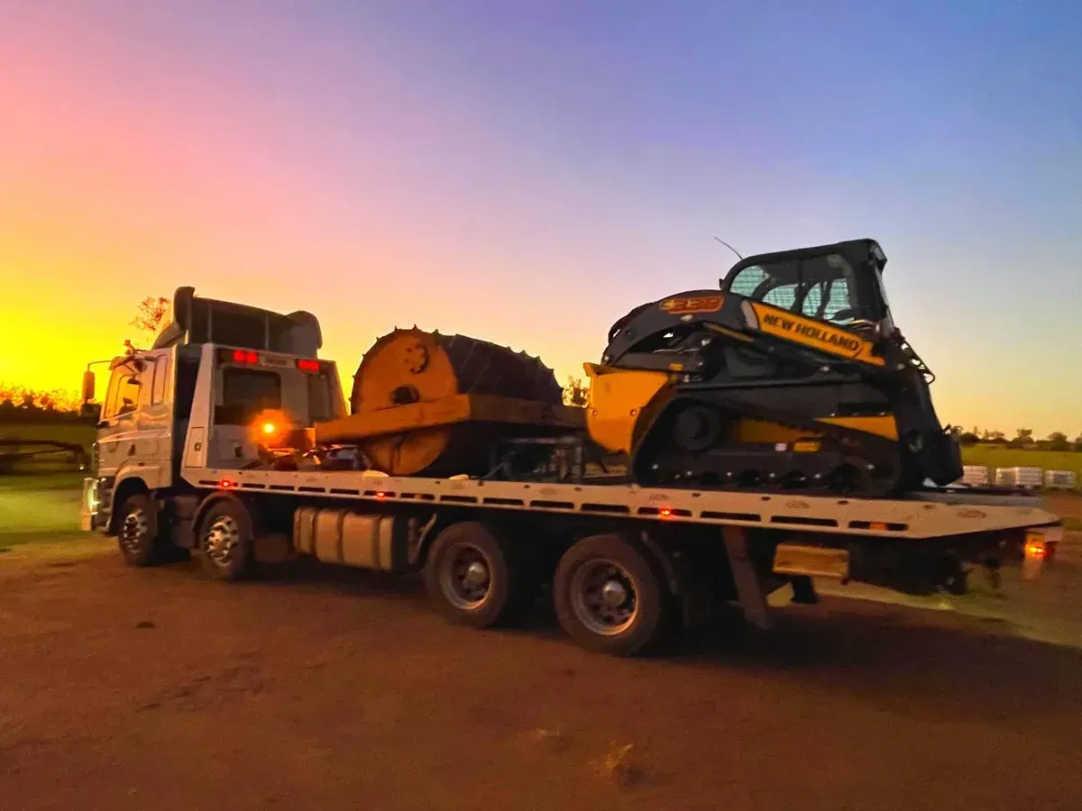 A Flatbed Truck Transports a Yellow Drum Roller — Tamworth Tilt Trays in Tamworth, NSW