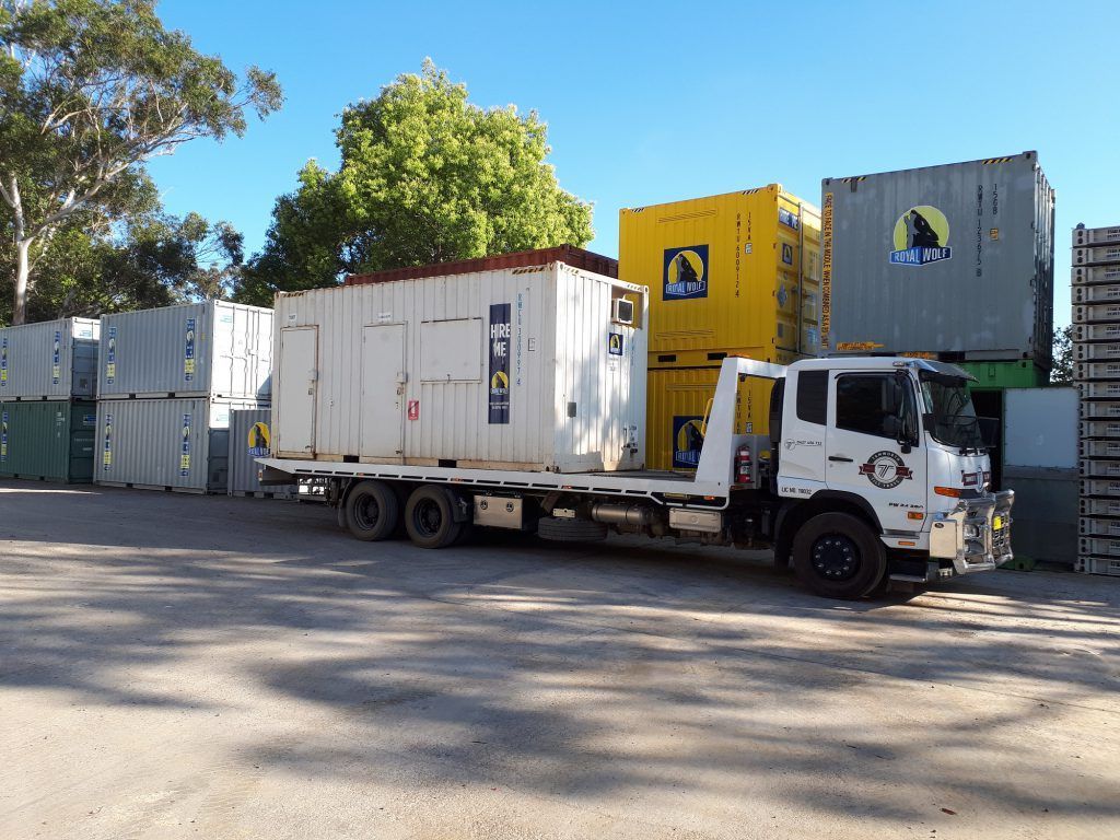 Shipping Containers And A Truck Outside