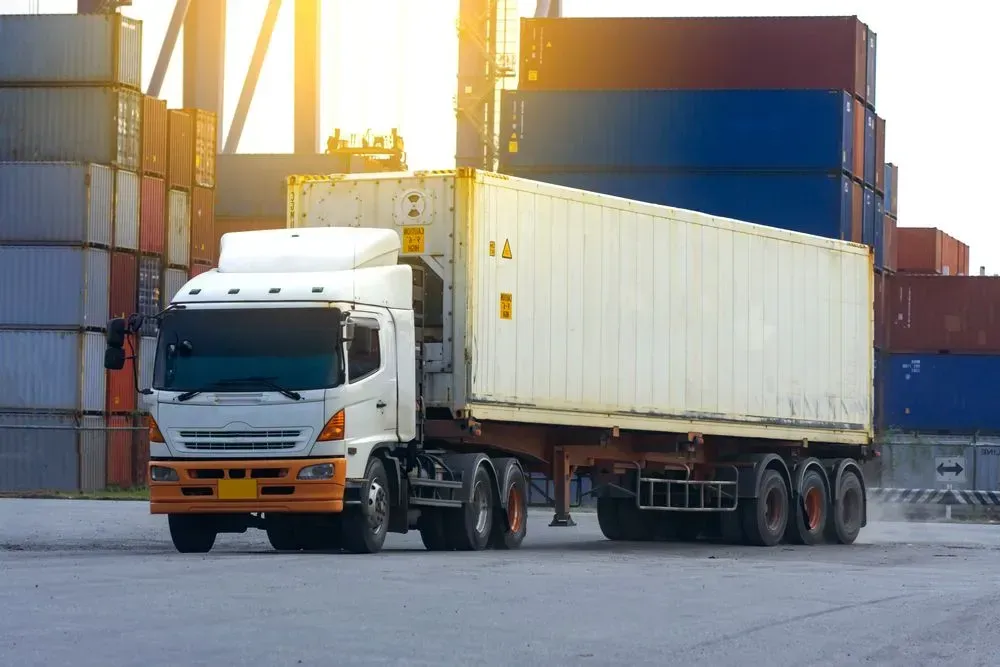 A White Semi-Truck Pulling a Container Trailer — Tamworth Tilt Trays in Tamworth, NSW