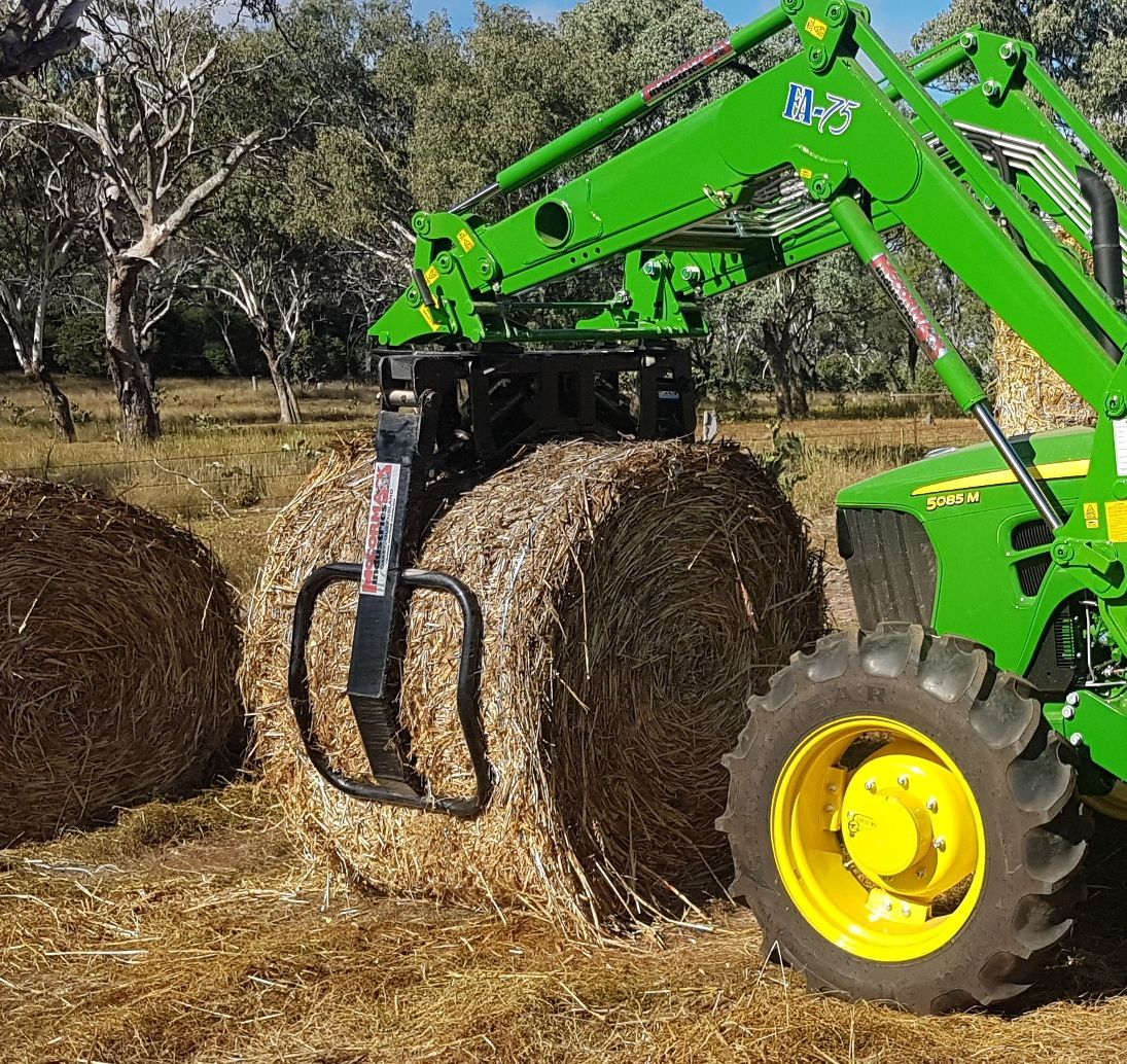 John Deere with round bale grab