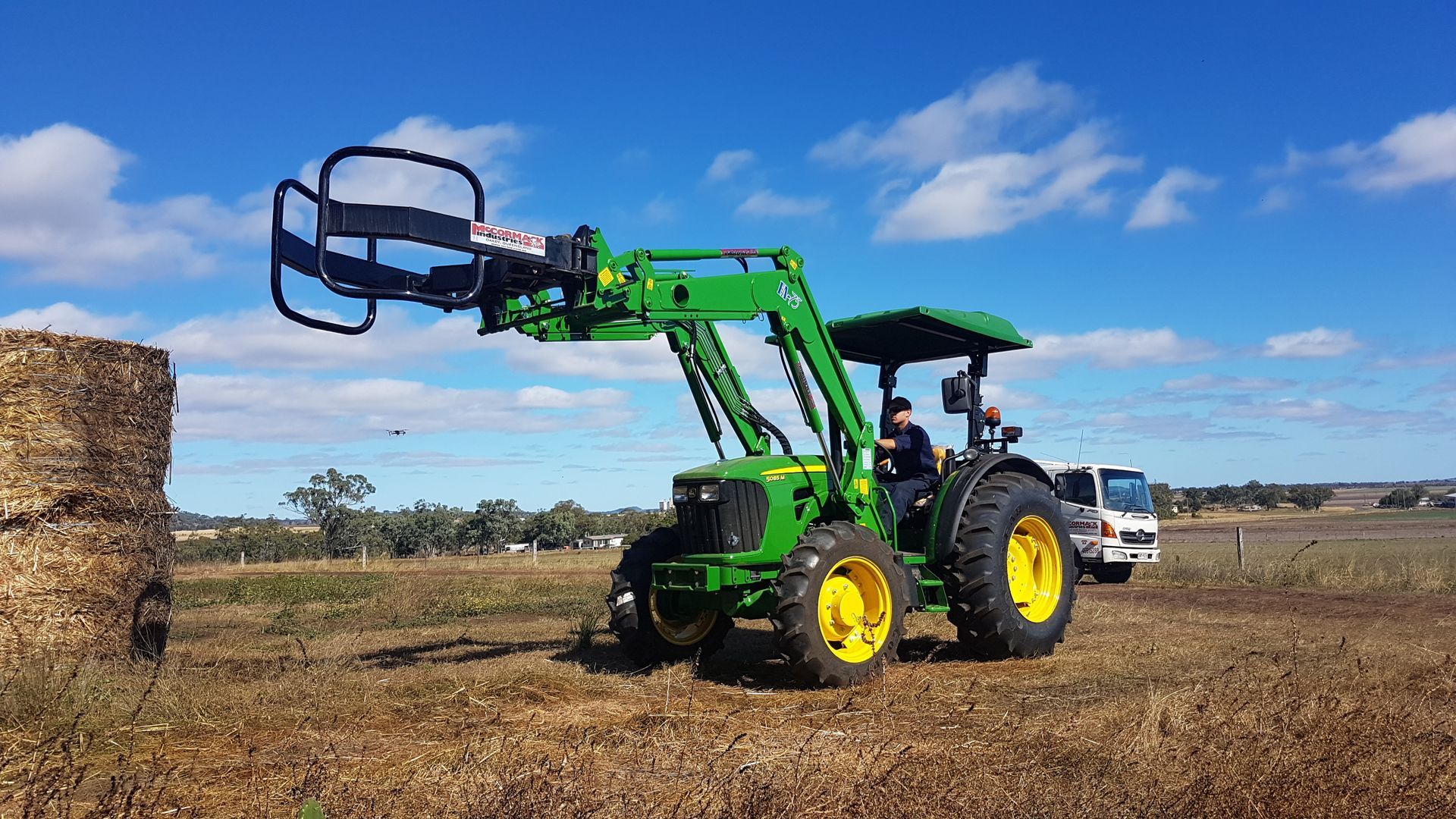 John Deere with round bale grab