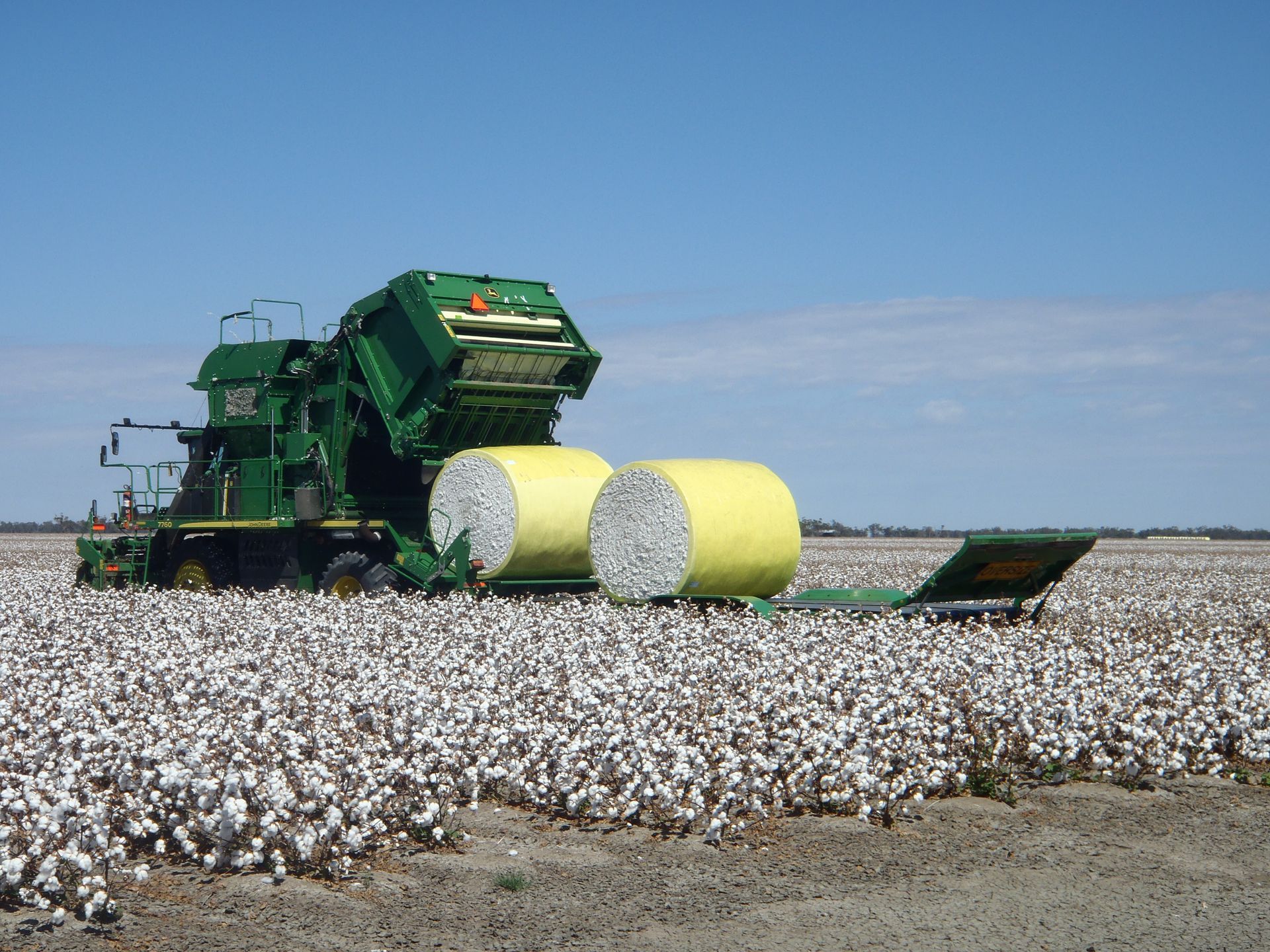 John Deere 7760 with cotton bale trailer 