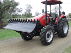 Tractor under axle blade rake 