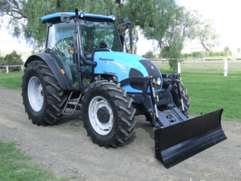 Tractor over axle blade