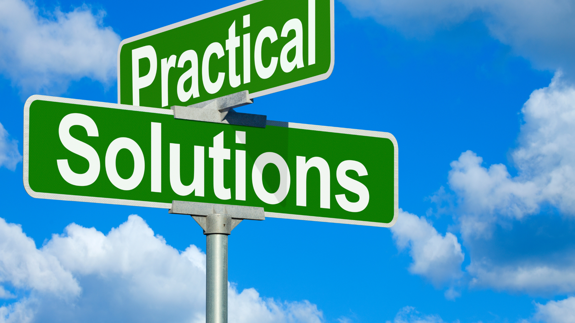 Green street signs reading “Practical Solutions” against a blue sky with clouds.