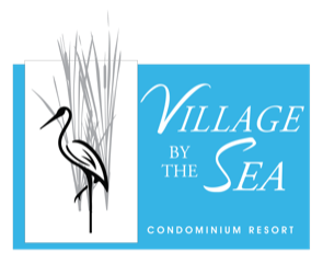 Logo for Village by the Sea Condominium Resort: a heron and reeds on a white rectangle, turquoise background.