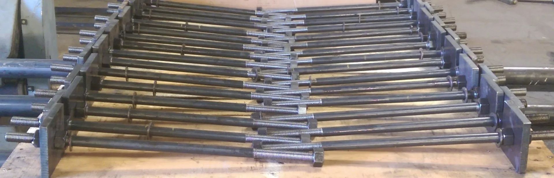 A metal chain is sitting on top of a wooden table.