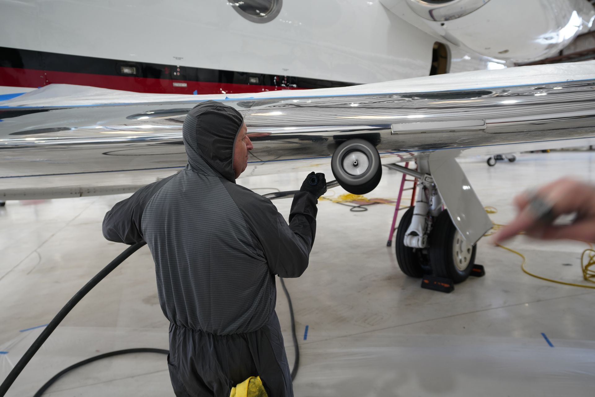 Aircraft brightwork polishing restoring reflective metal underside of wing