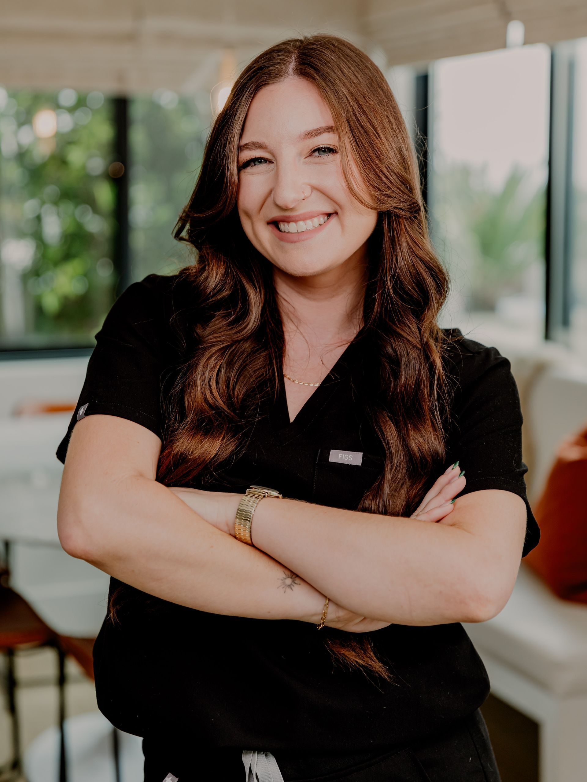 woman smiling with arms crossed