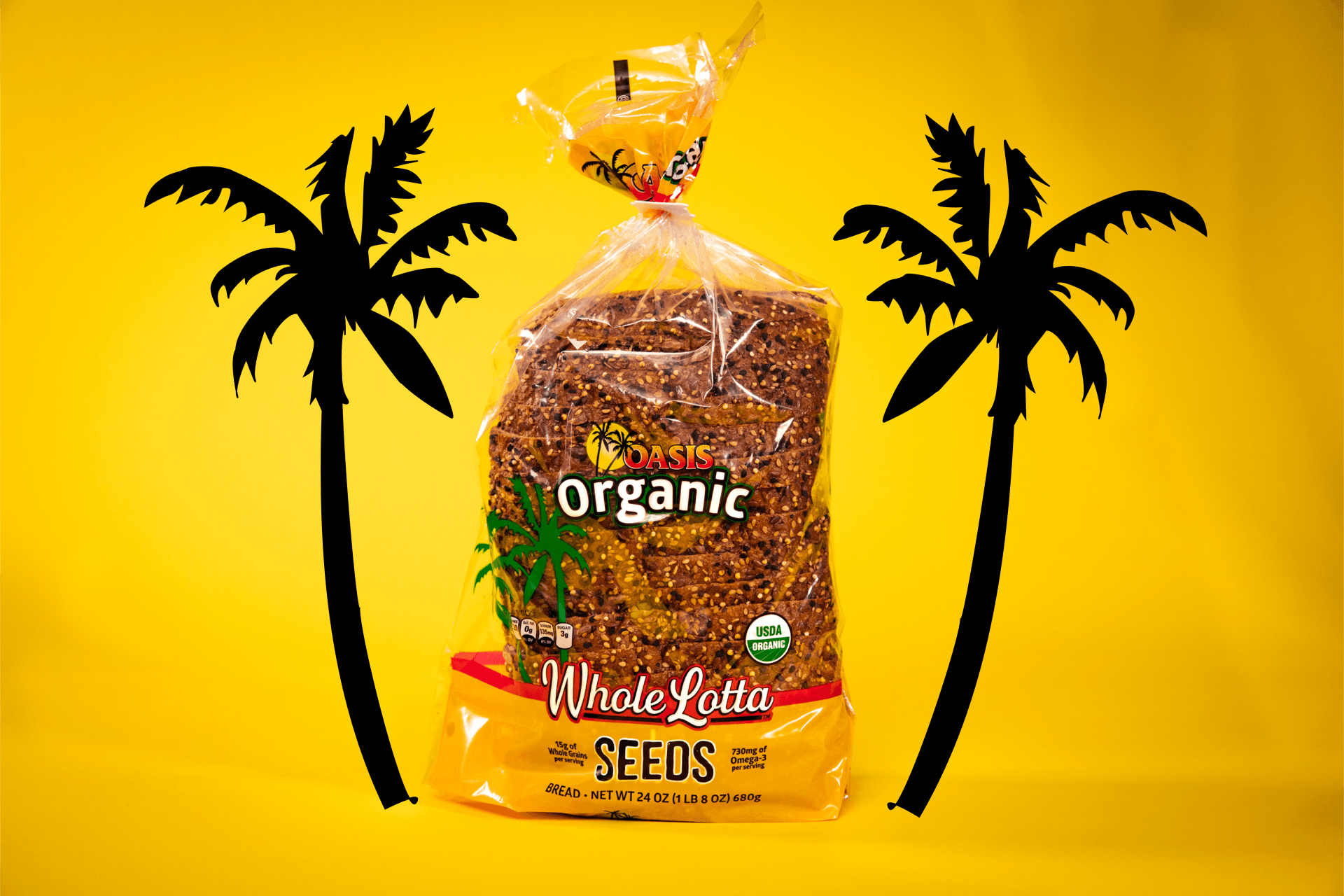 A bag of organic wheat rye bread with two palm trees in the background
