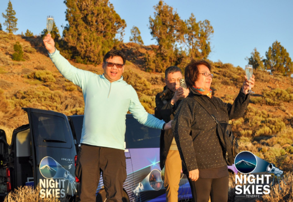 Private tour guests beside the Night Skies Tenerife coach during a scenic stop