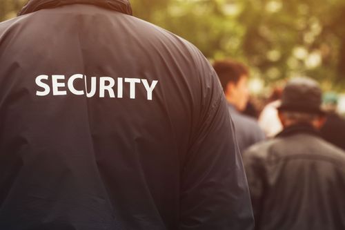 A close-up view of a dark jacket with the word 