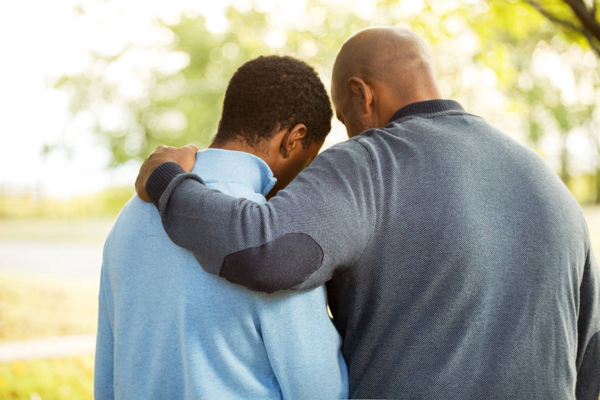 Fathers arms around his son — Frisco, TX — Paternity Testing Solutions