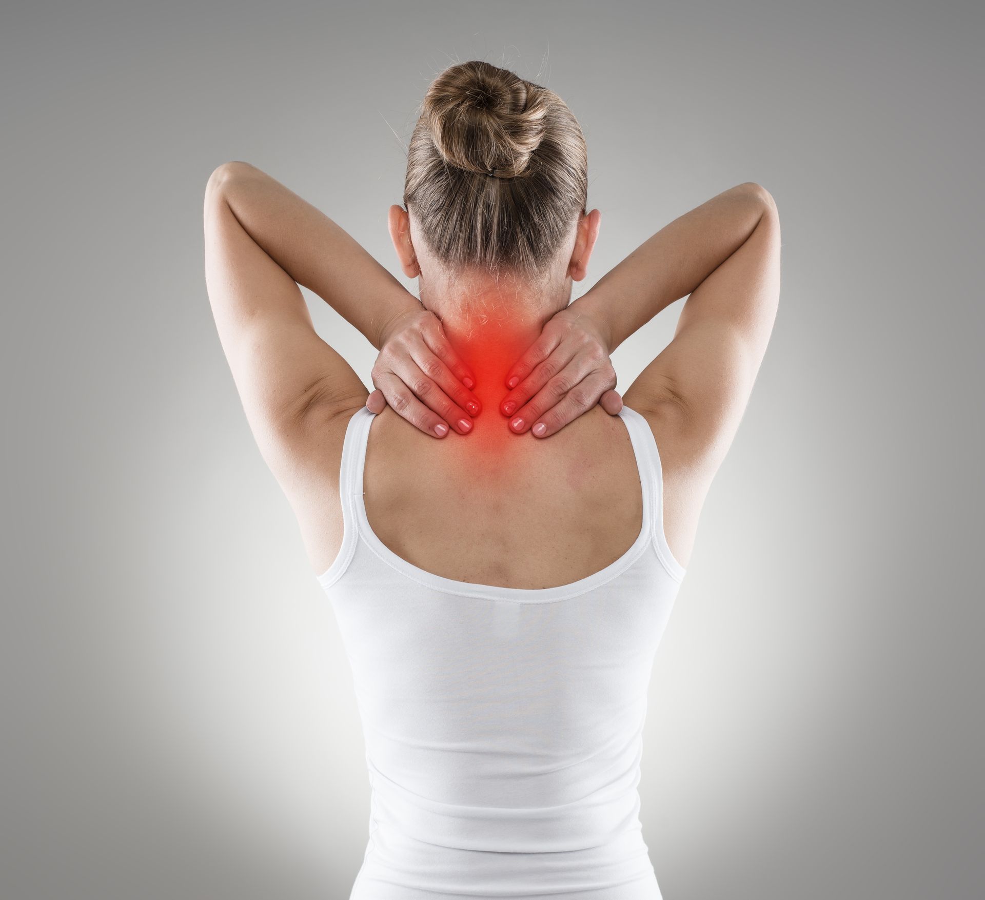 Woman holding neck in pain; red highlight indicates area of discomfort.