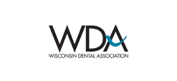 Wisconsin Dental Association logo in black and blue text on a white background