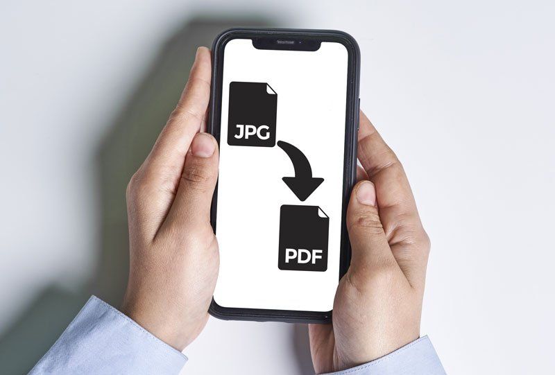 Holding phone with image format conversion software