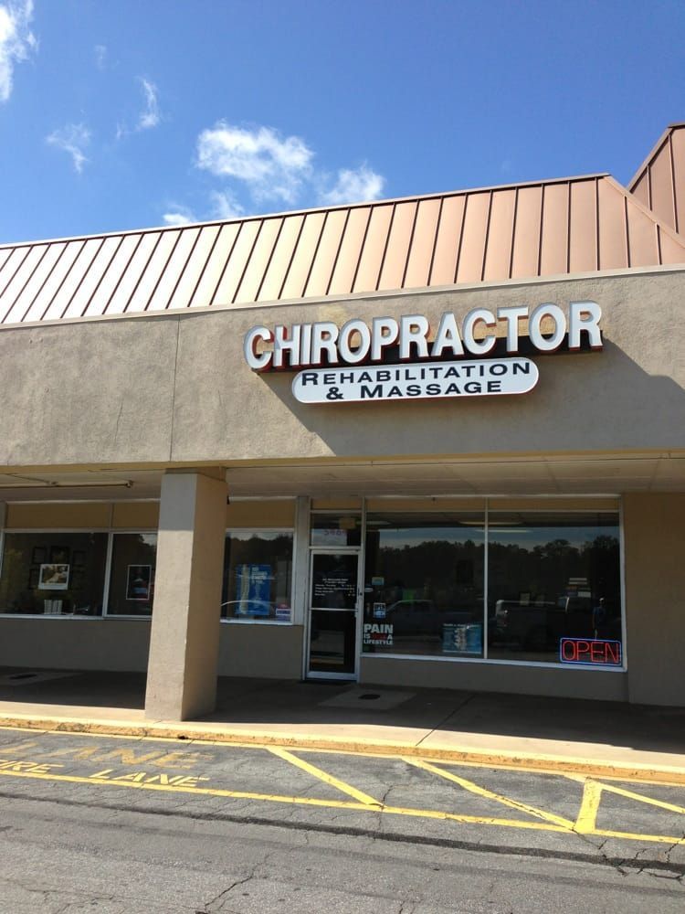 Exterior of a chiropractic office with signage: 