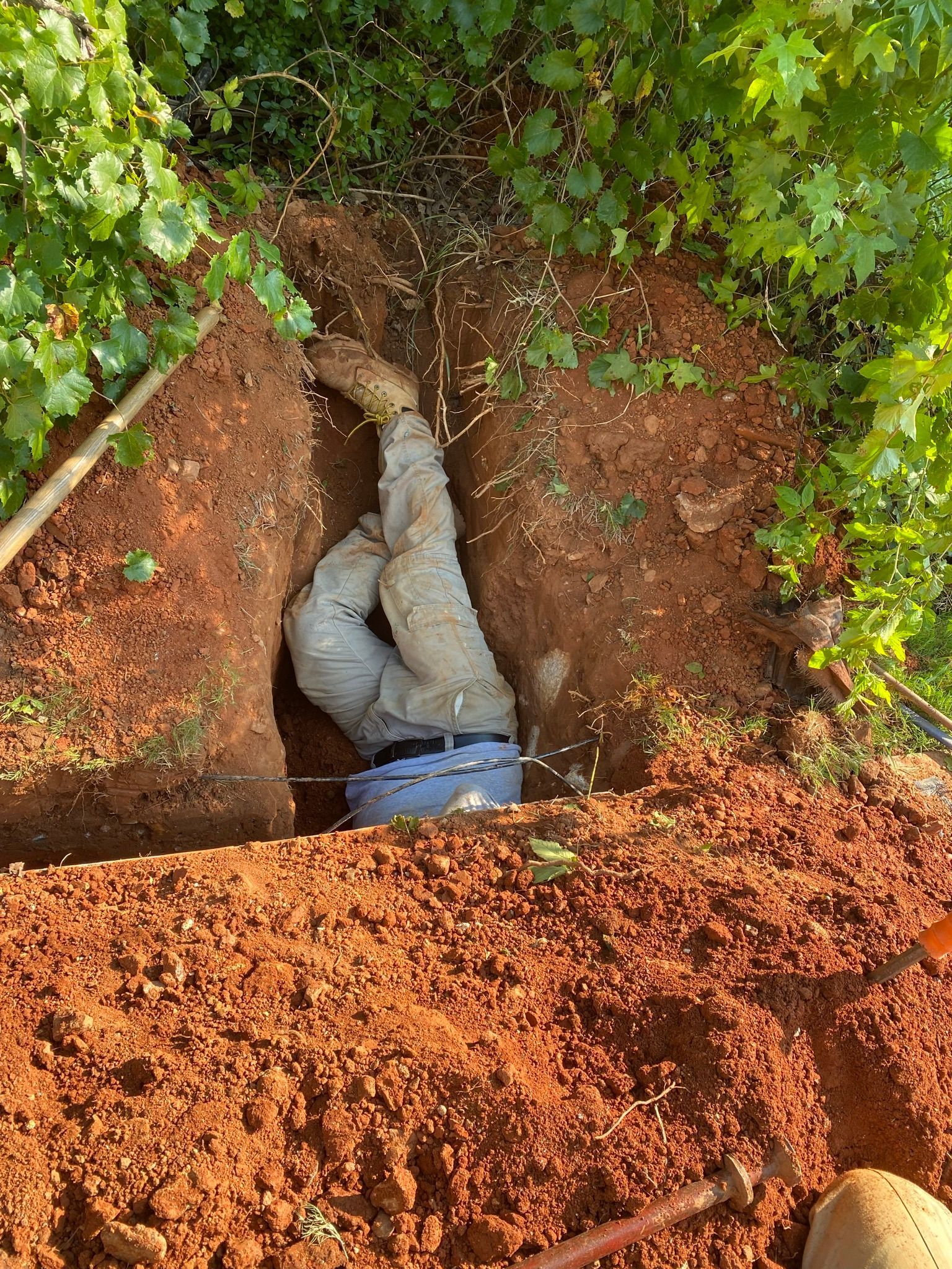 Man under the Pit — Flowery Branch, GA — All About Irrigation and Landscape Services Inc