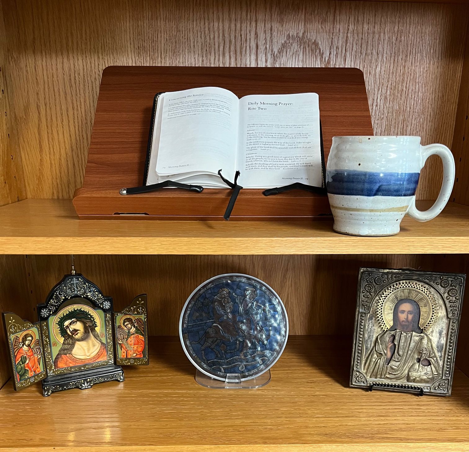 Coffee mug, icons, and Book of Common Prayer
