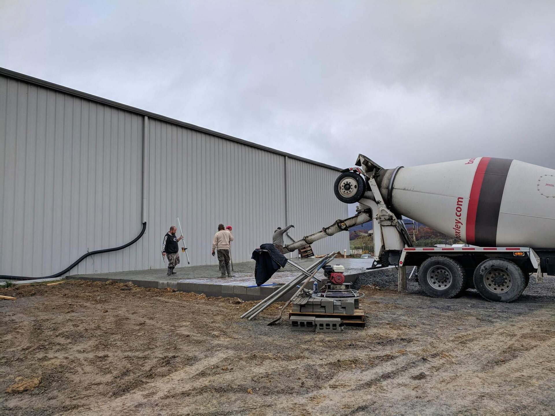 men pouring cement