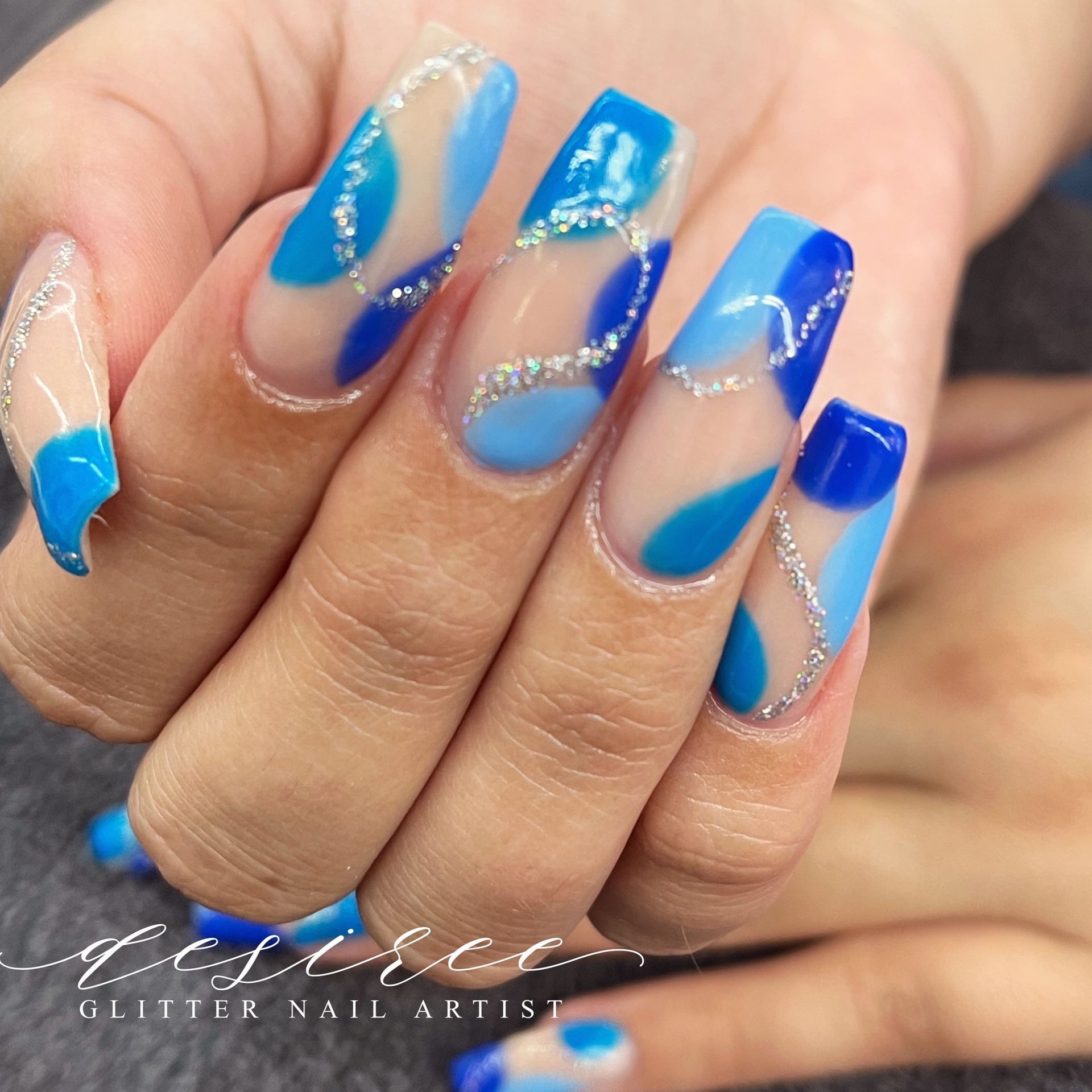 Custom manicure with intricate nail art design