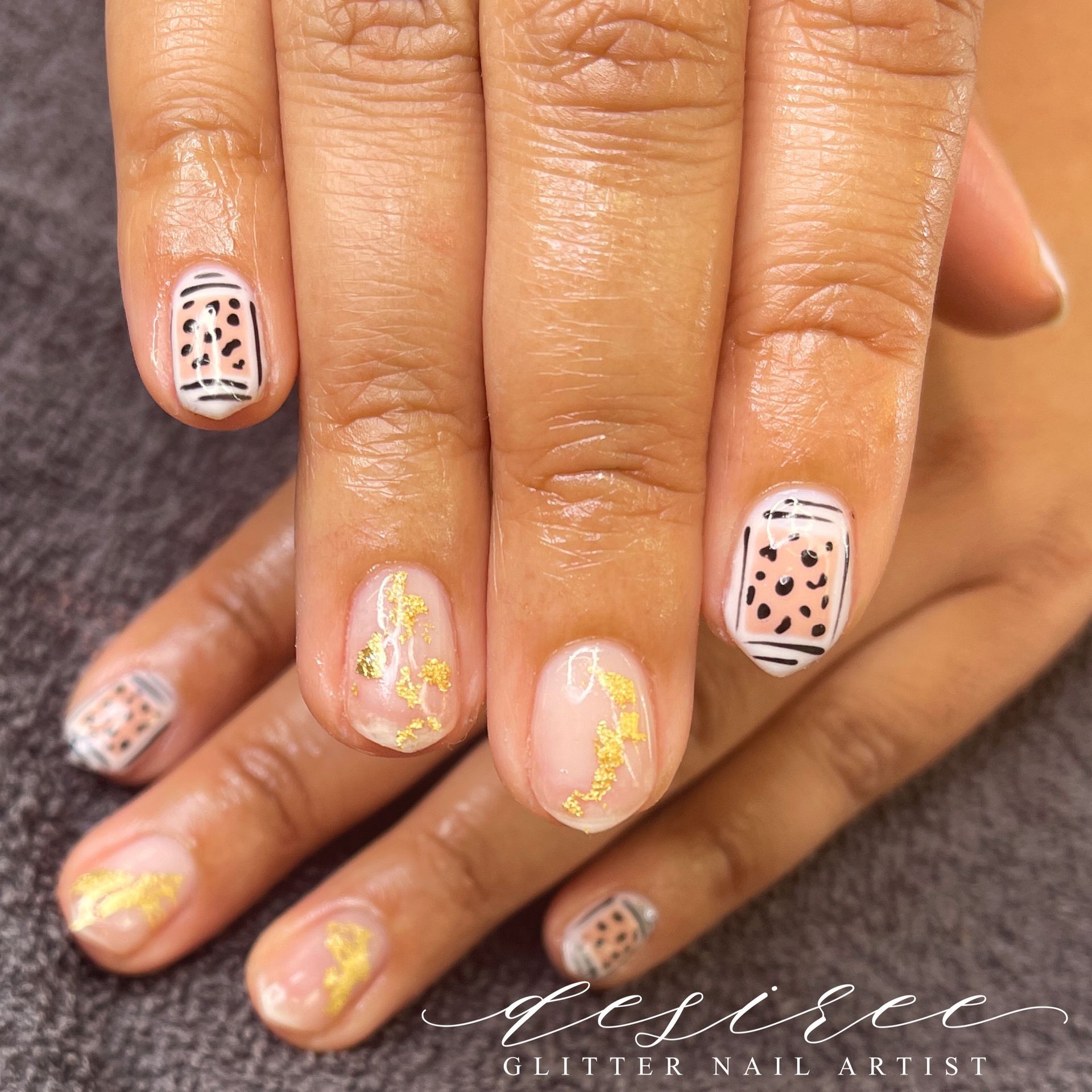 Hard gel nail enhancements with artistic design