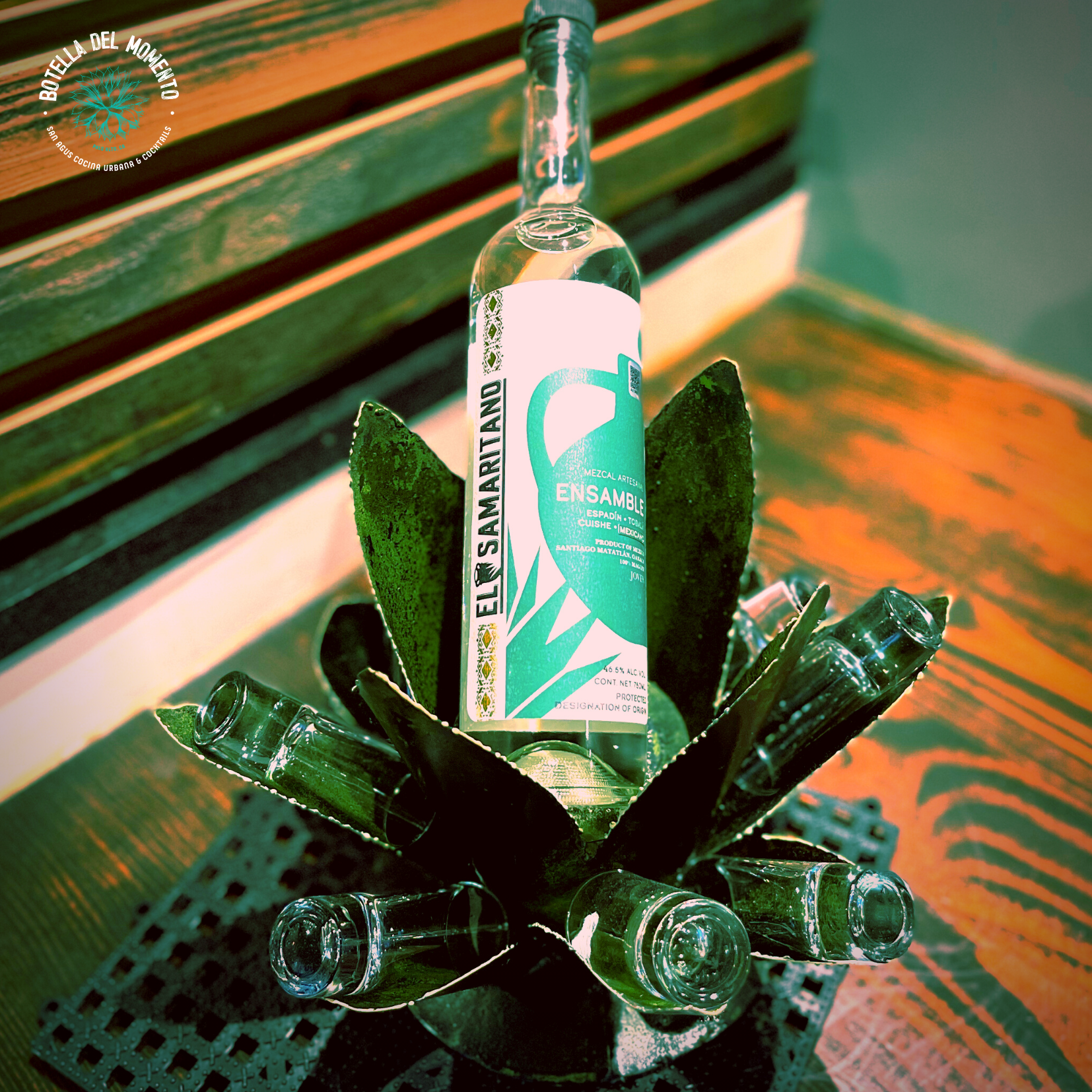 A bottle of fly samaritano sits on a wooden table