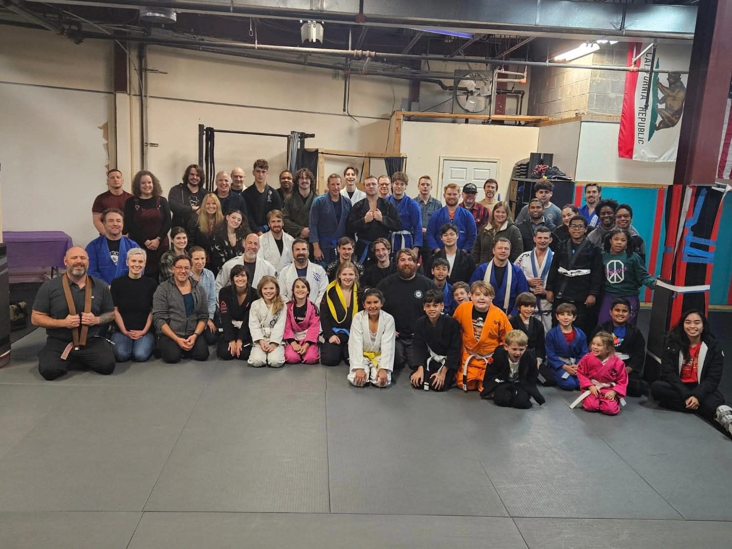 Families practicing partner drills at Infinity Jiu-jitsu and Judo in Timonium, MD.