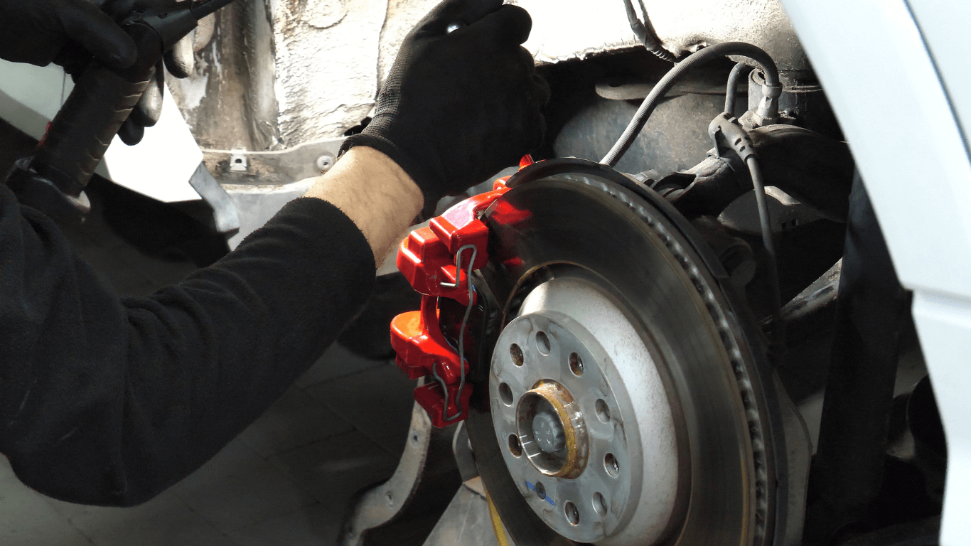 a mechanic doing a brake service