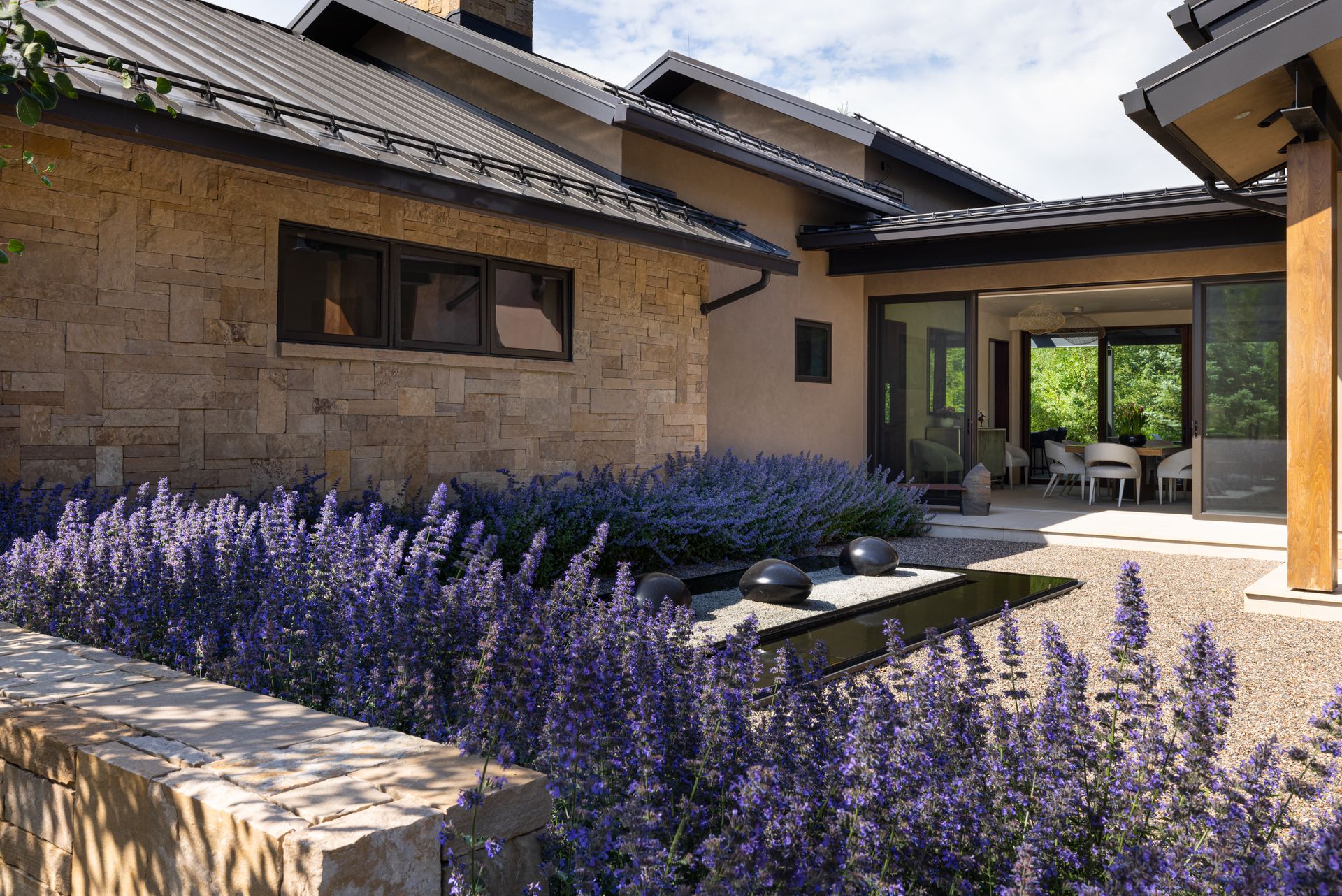 A house with purple flowers in front of it