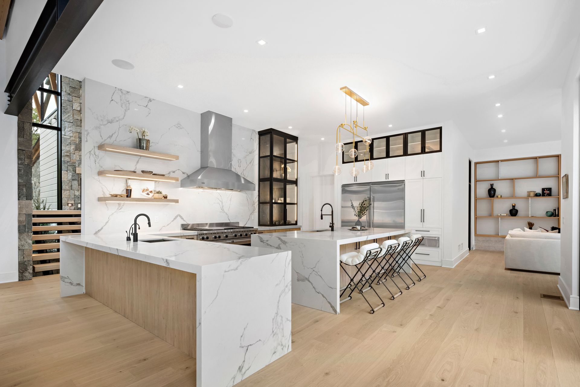 A kitchen with a large island in the middle of the room.