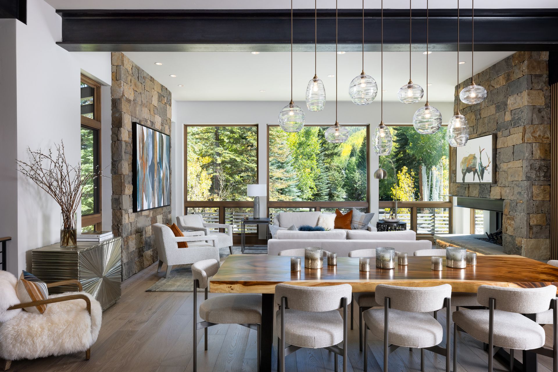 There is a dining table and chairs in the middle of the room.